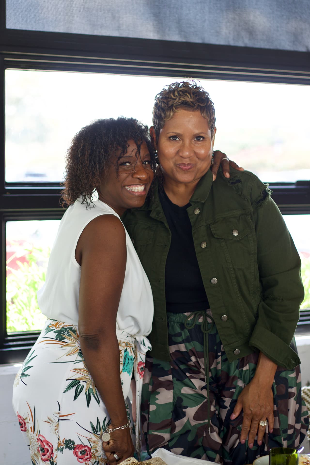 Two guests embracing at the CEOMOM Power Luncheon